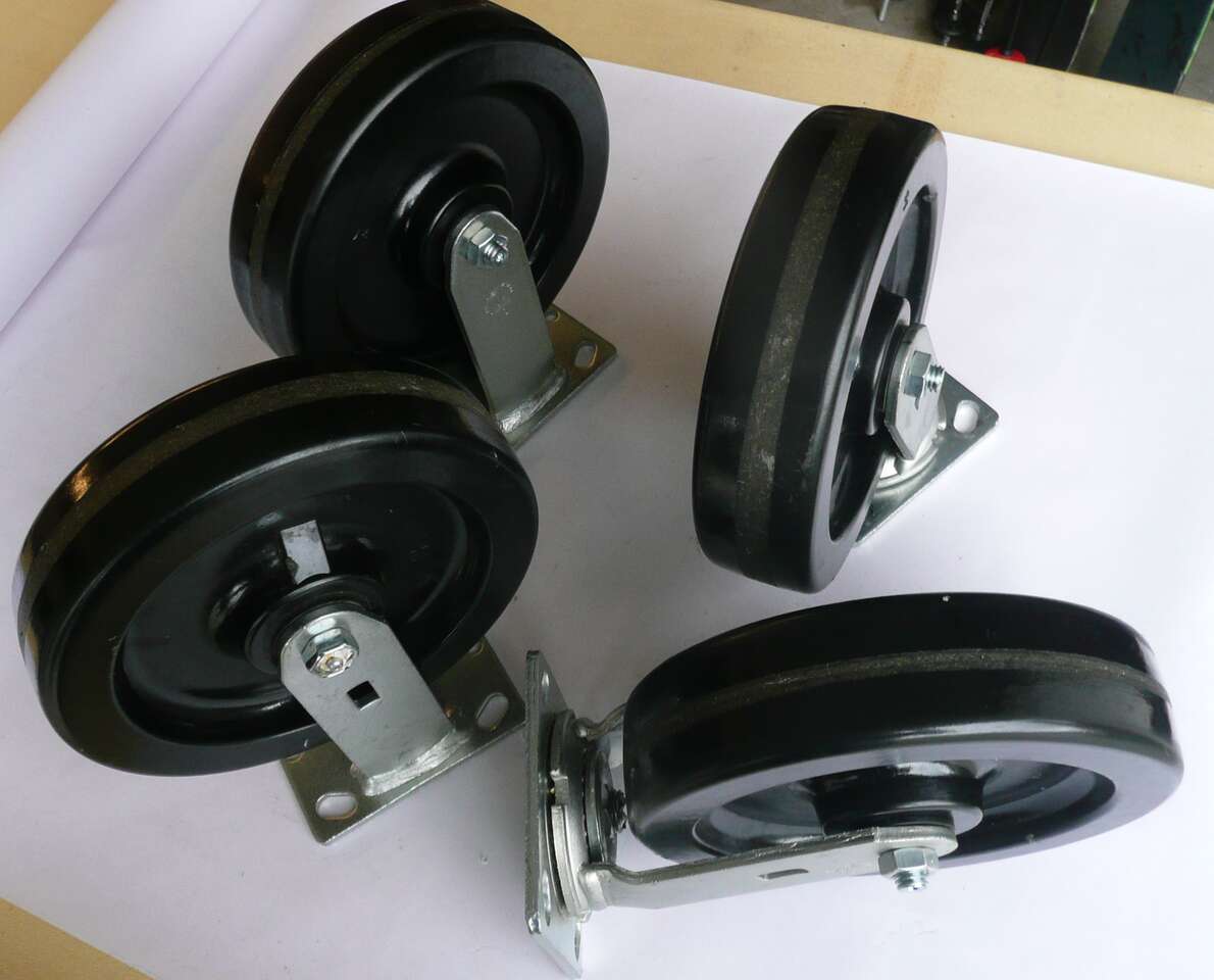 FOUR (4) new 8 inch castors (2 fixed +2 on swivel)