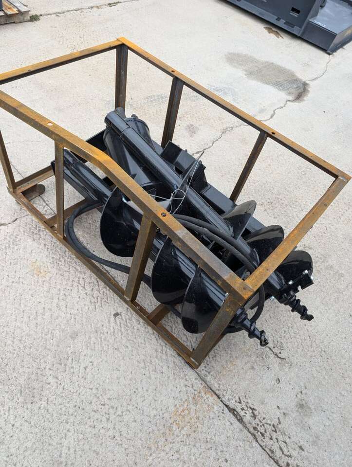 Bran new skid steer post hole digger with bits