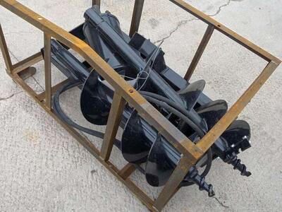 Bran new skid steer post hole digger with bits