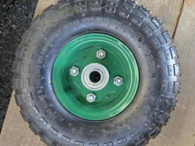 4.10/3.5-4 Green Flat Free, Solid Tire and Wheel