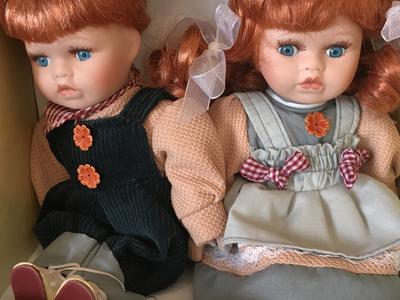 Porcelain dolls (boy and girl)
