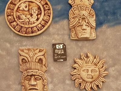 Four Small Hanging Figurines