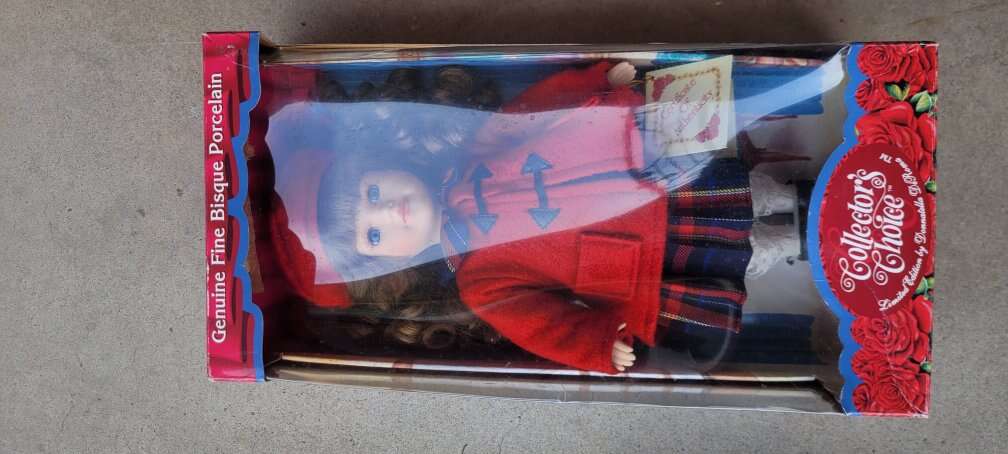 doll in box with stand and certificate