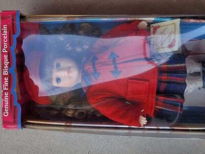 doll in box with stand and certificate