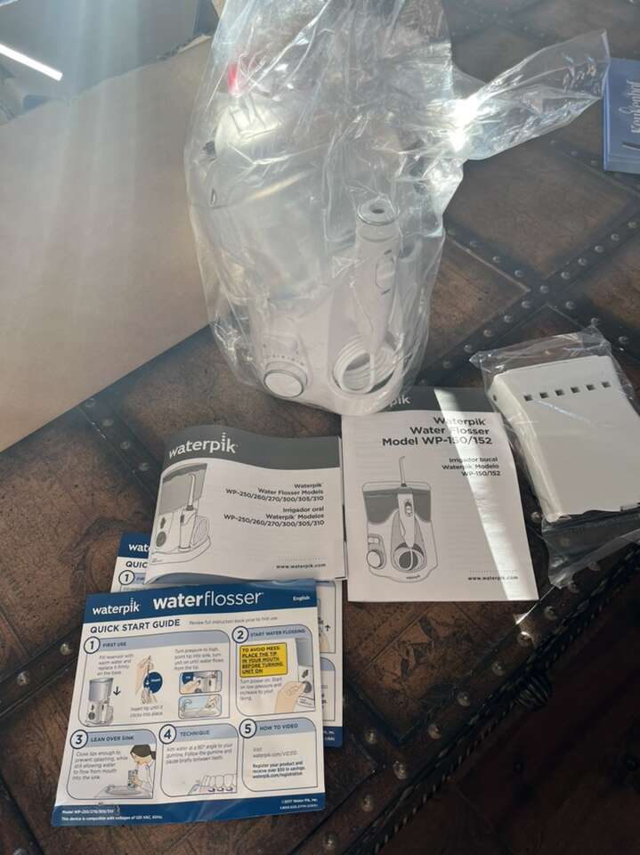 Brand New Still Sealed Waterpik Water Flosser