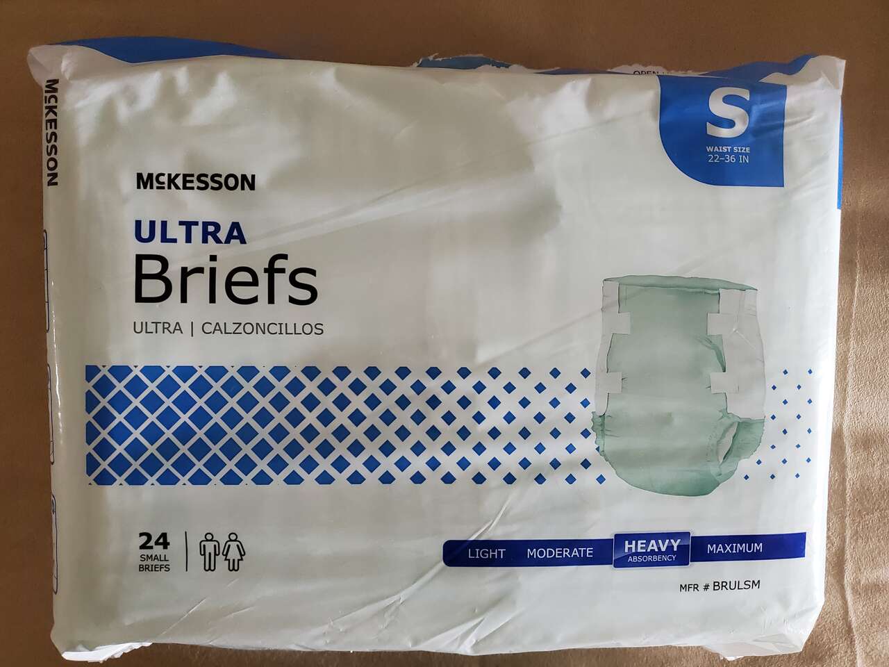 Assorted packages of Adult Disposable Briefs, Pads and 2 Mattress Protectors