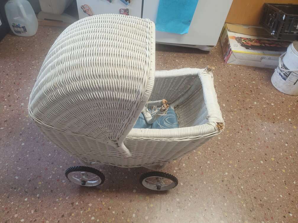 Vintage white wicker baby carriage