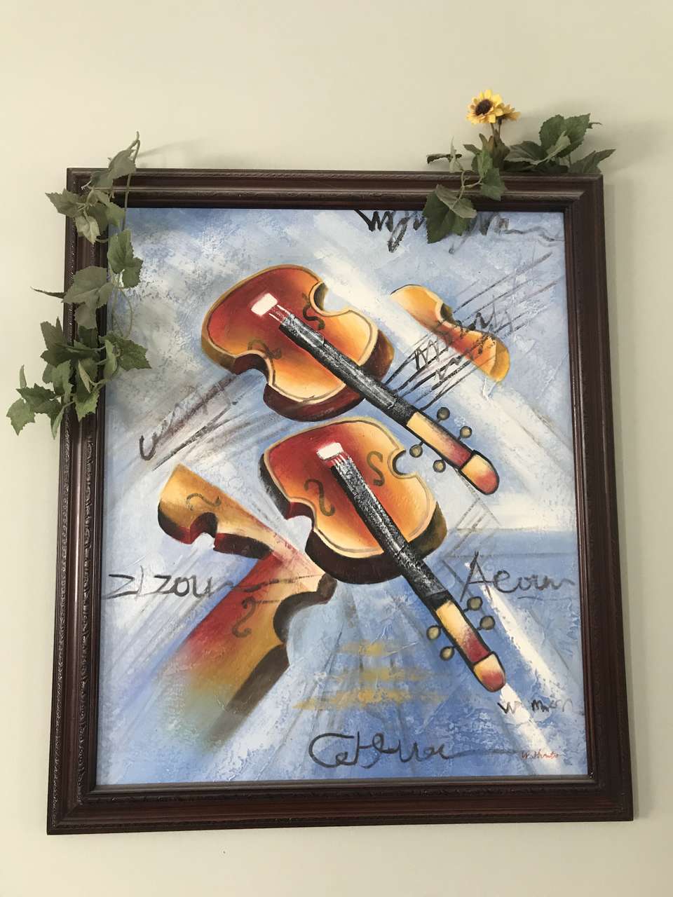 Violin picture on frame.