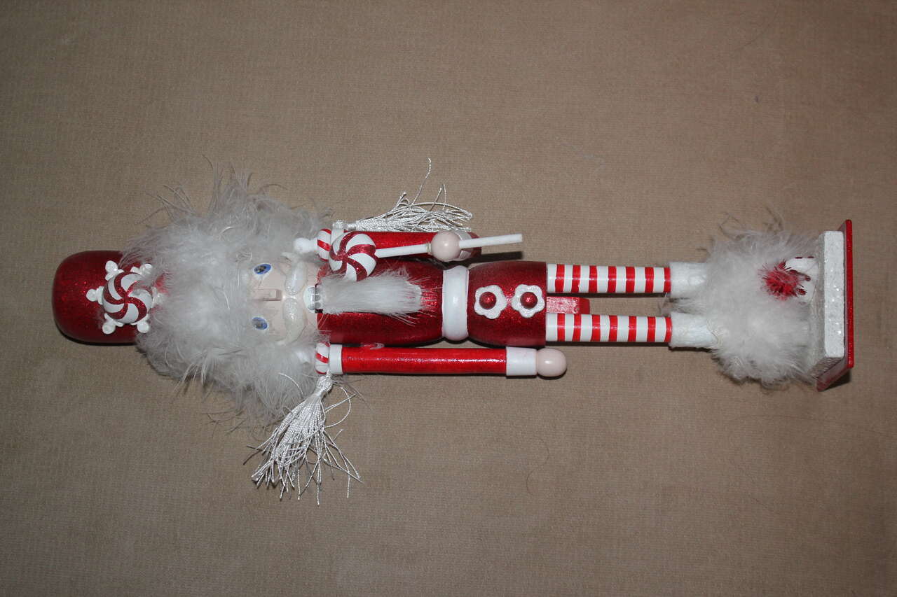 Wooden Nutcracker with Feather Accents