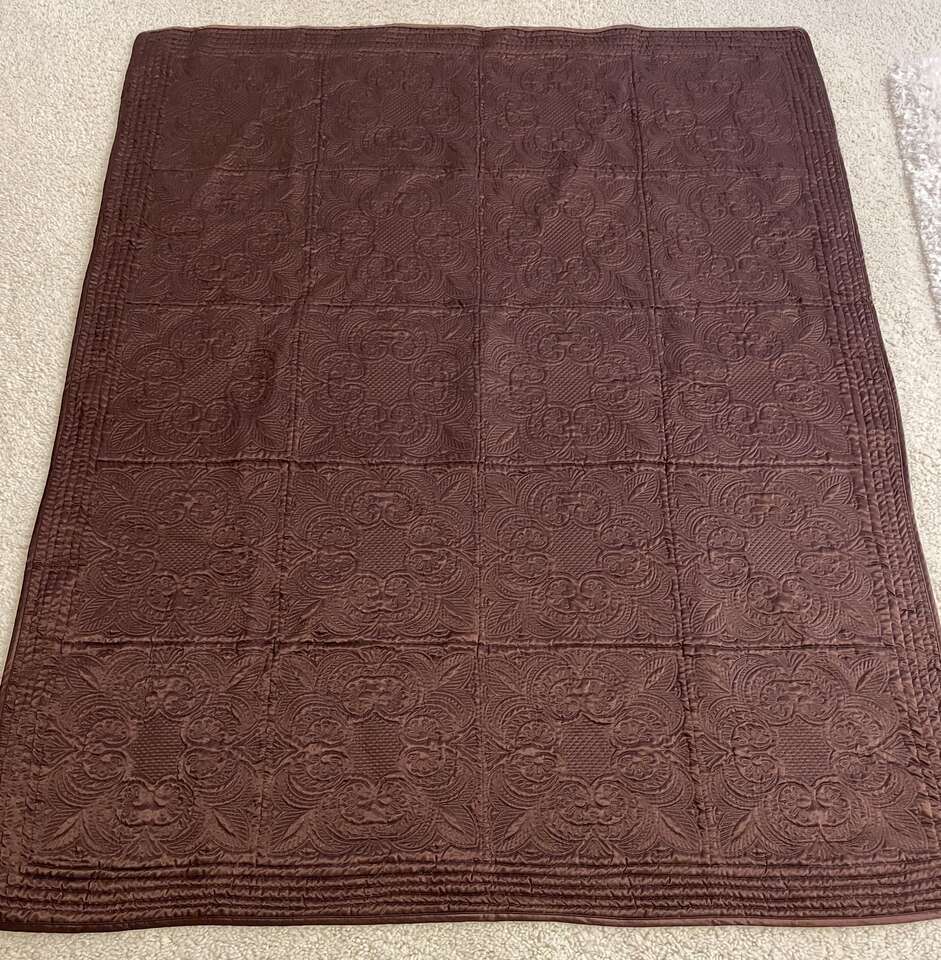 Brown quilted Throw. Silky Material