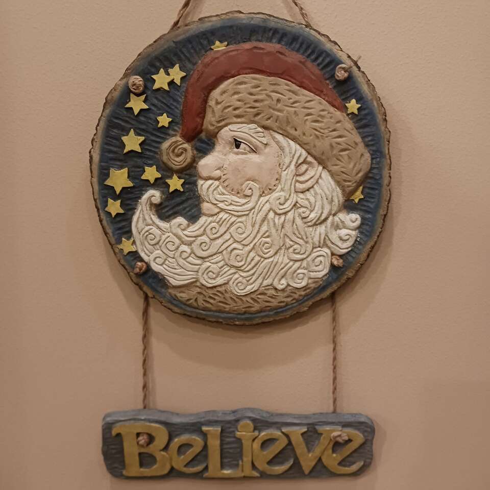 Santa believe sign