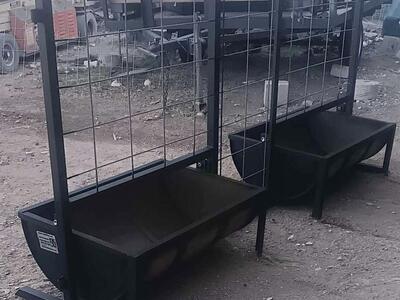 New, fence panel with built-in open top hog feeder