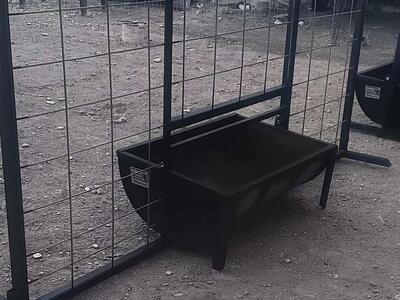 New, fence panel with built-in open top hog feeder