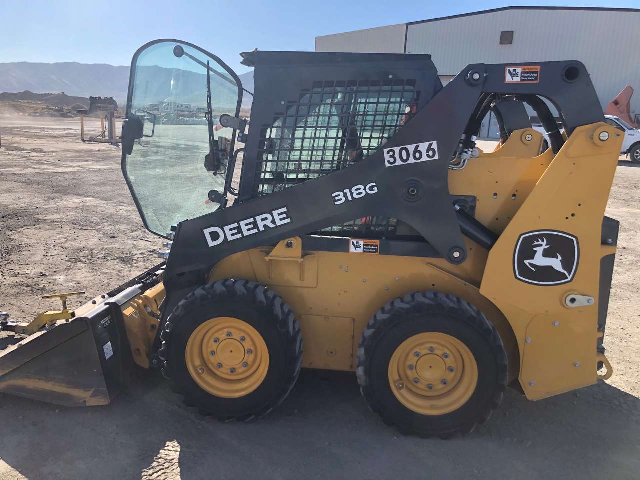 John Deere skid steer bobcat for rent. 318G with cab and hand controls