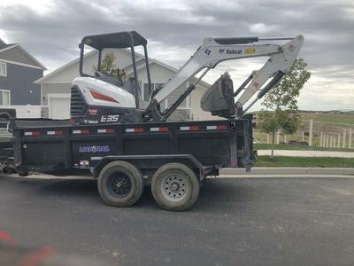 Bobcat Mini excavator with cab and dump trailer combo special. The perfect package!