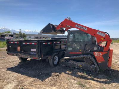 Track skid steer and 7x14 dump trailer combo. Track skid loads right into dump trailer