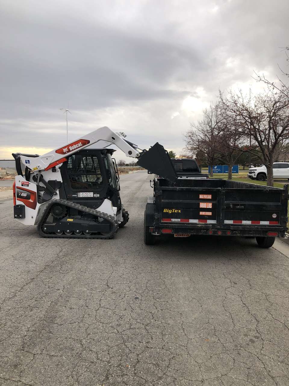 Bobcat Track Loader skid steer for rent. Package with dump trailer for best value!