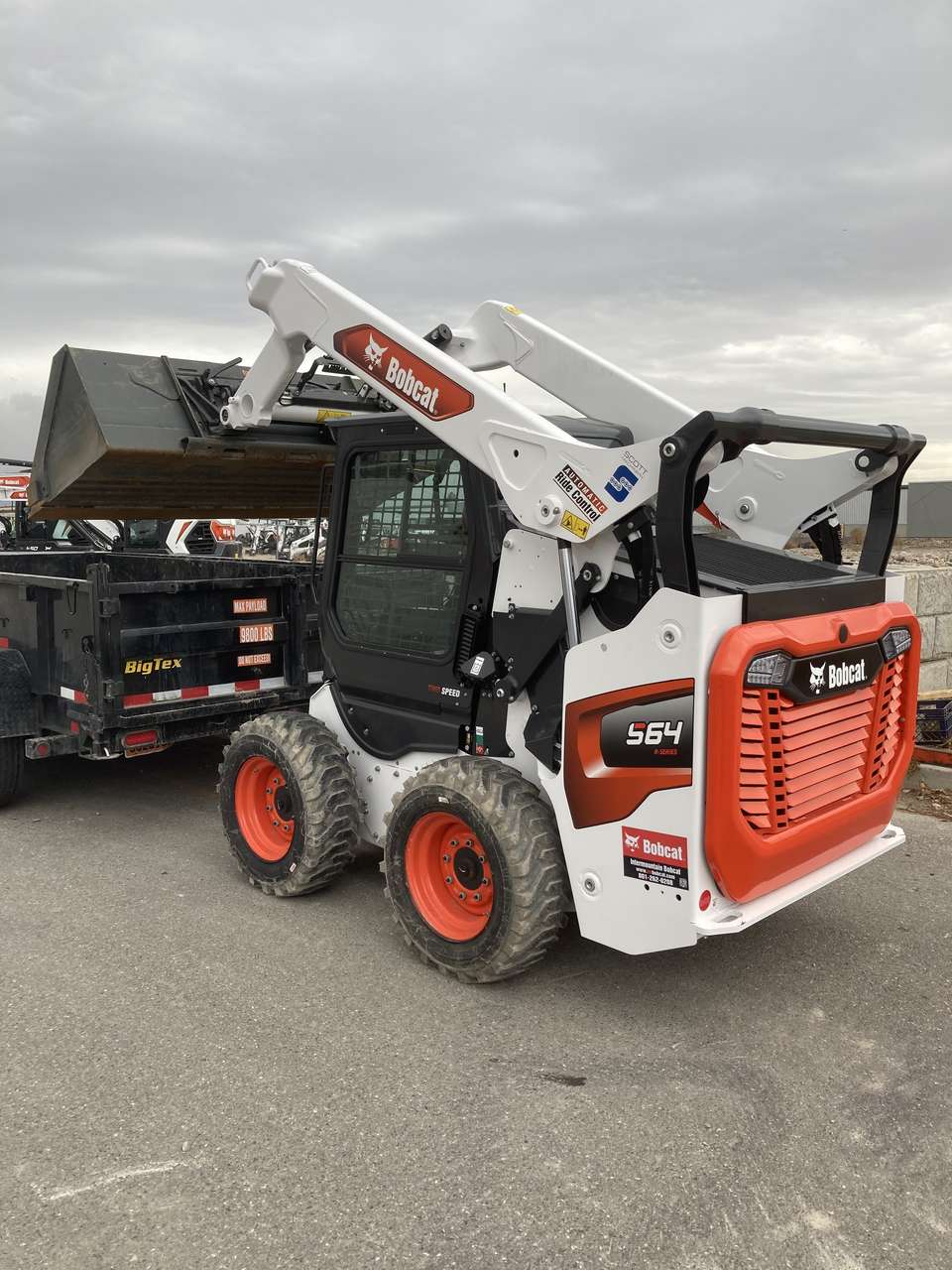 Bobcat skid steer and dump trailer for rent - great versatility for any size job