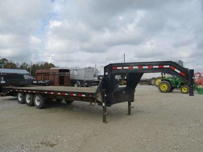 32' Gooseneck flatbed trailer for rent. Has dovetail ramps, deck-over style. Haul anything!! 25K