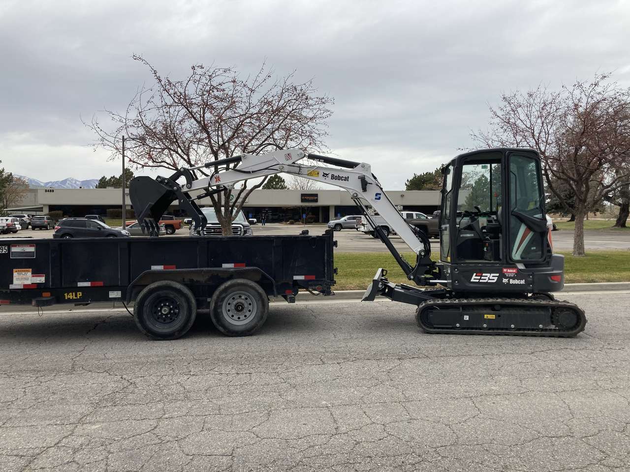 COMBO PRICE! Bobcat Mini Excavator with cab and dump trailer combo for rent