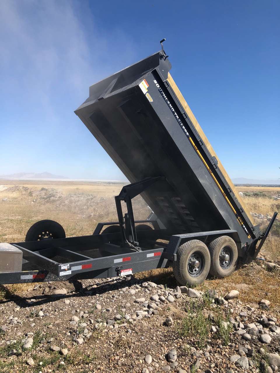 Large 7x14 Dump trailer for rent. 14k axels, heavy duty. Great for dirt, concrete, gravel, and more!