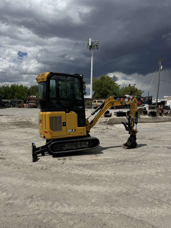 2024 Cat 302 Mini Excavator. Fits through 40 inch gates.