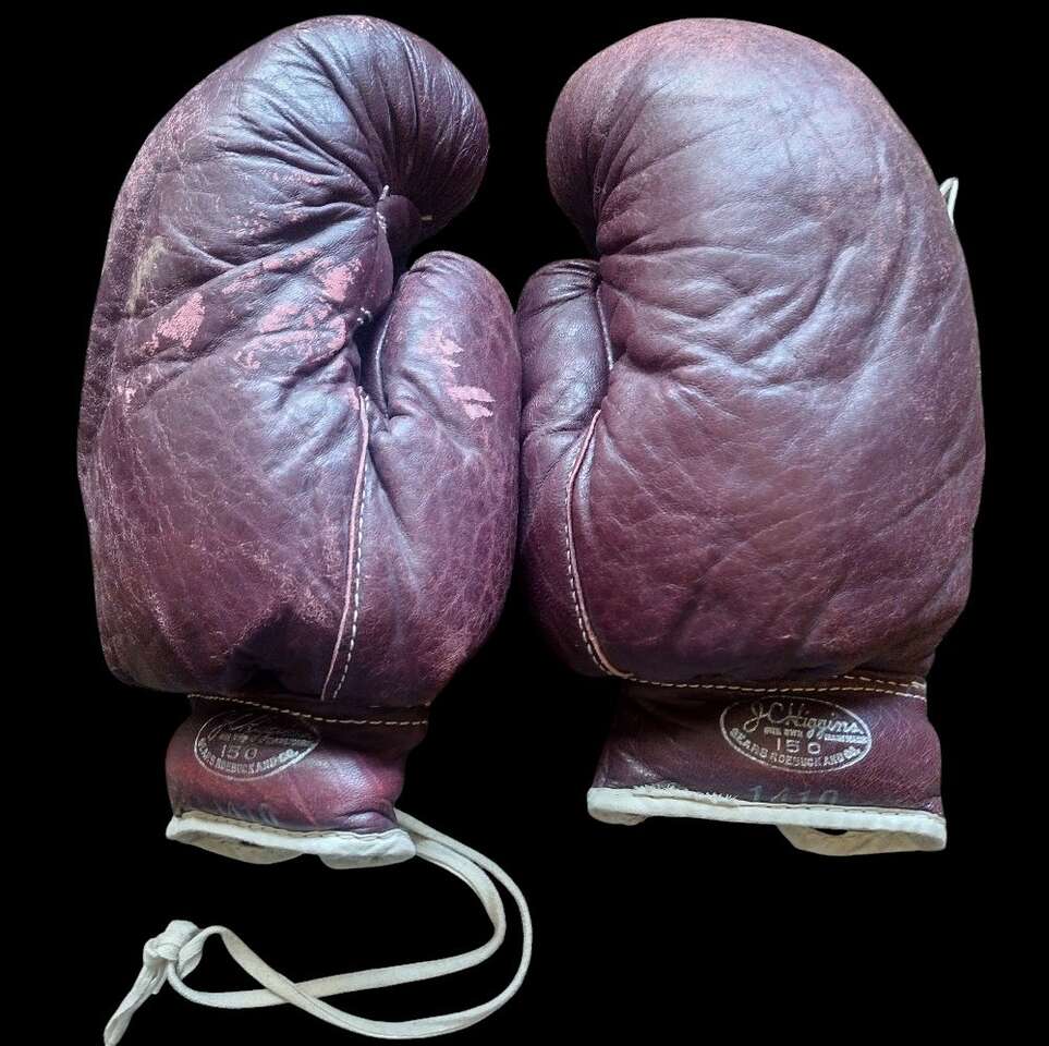.
. VINTAGE J.C. HIGGINS LEATHER BOXING GLOVES C.1