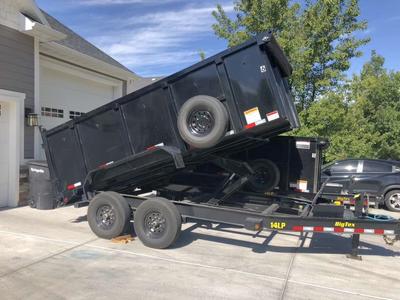7x14 with 4 foot sides 5 ton dump trailer rentals.