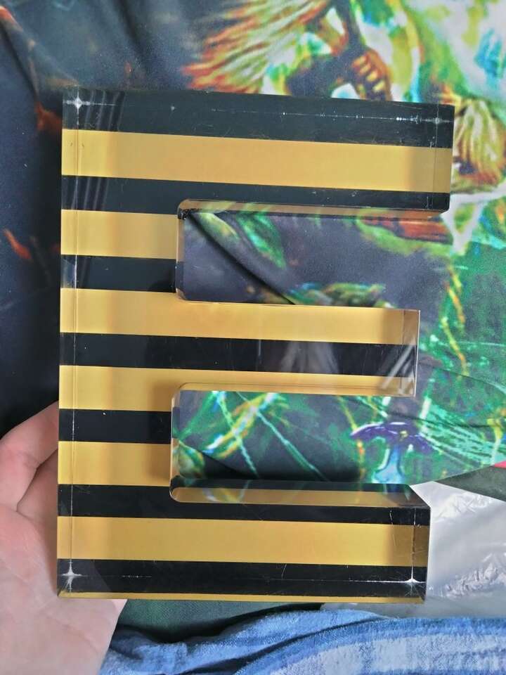 Glass Black And Yellow Striped Letter E