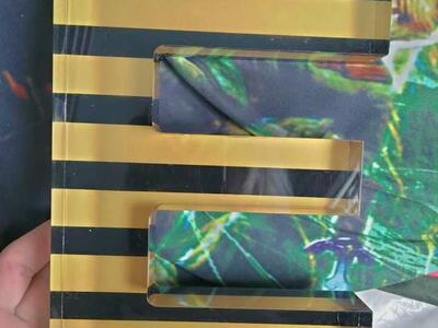 Glass Black And Yellow Striped Letter E