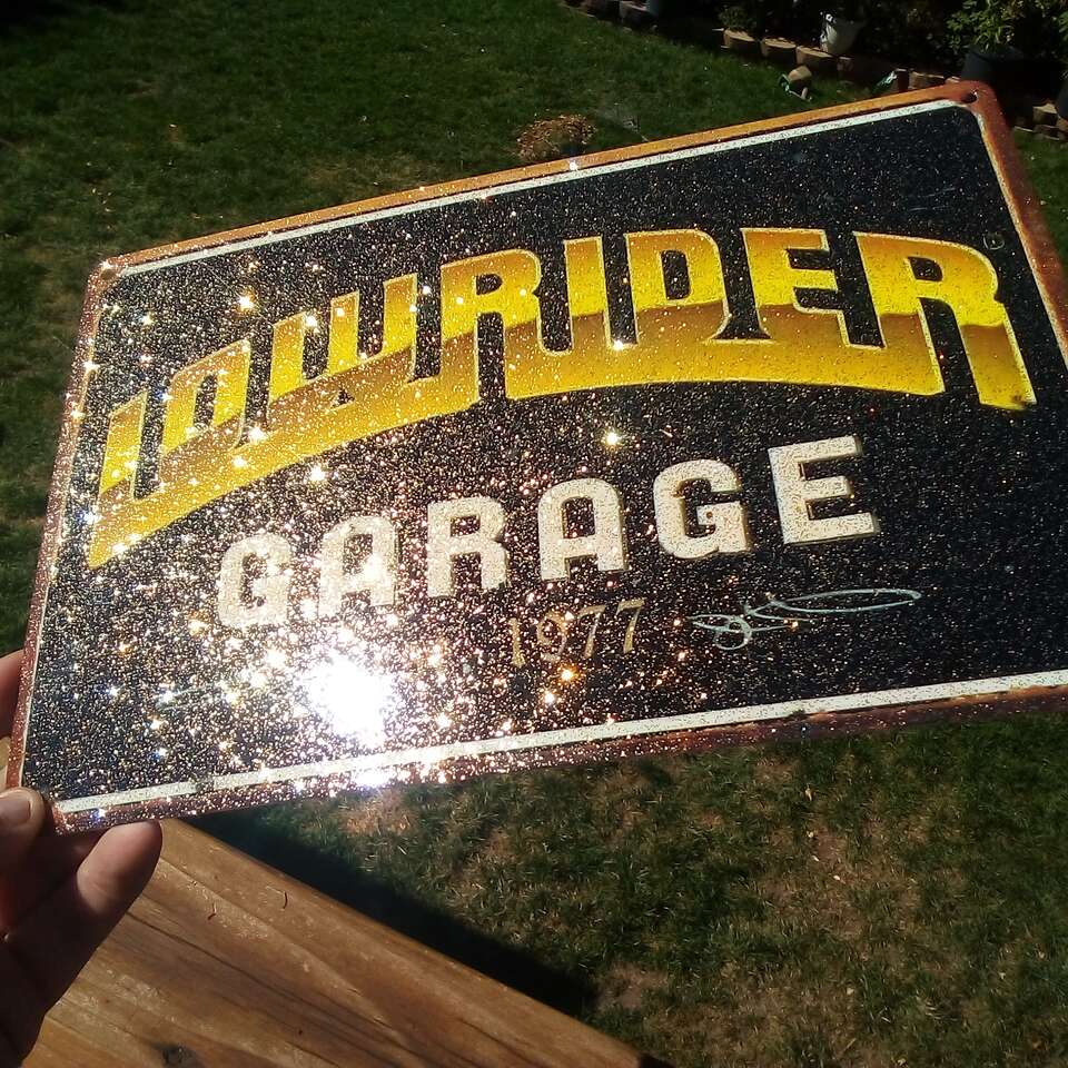 Gold metal flake lowrider magazine tin signs
