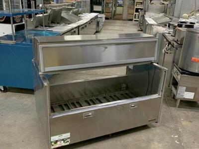 **Prices slashed!** Used Traulsen Stainless steel Passthrough Milk Beverage cooler next to new 50% Off Was$1995