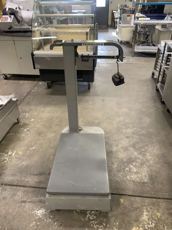 Used 1000 pounds Capacity platform Scale with weights , wheels , Floor Model