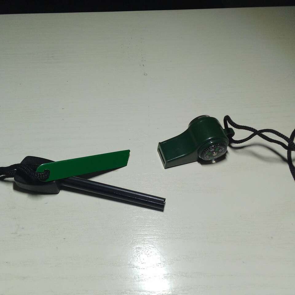 Survival whistle and fire starter