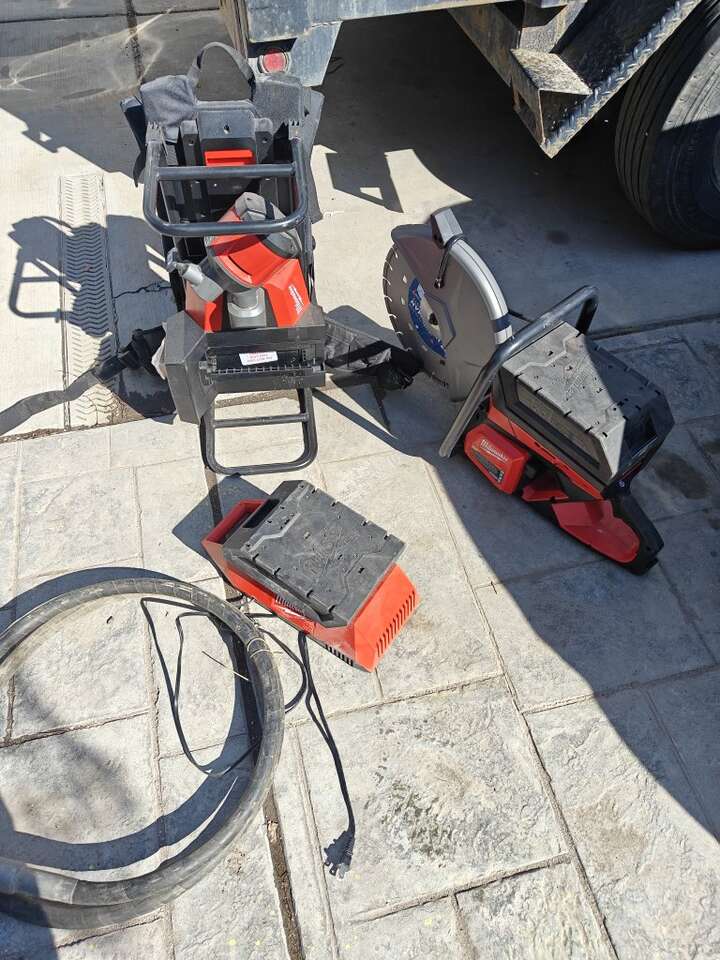 Milwaukee concrete vibrator and 14 " concrete saw