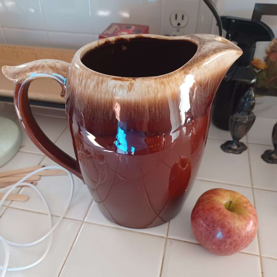 Brown pottery pitcher