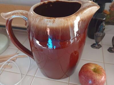 Brown pottery pitcher