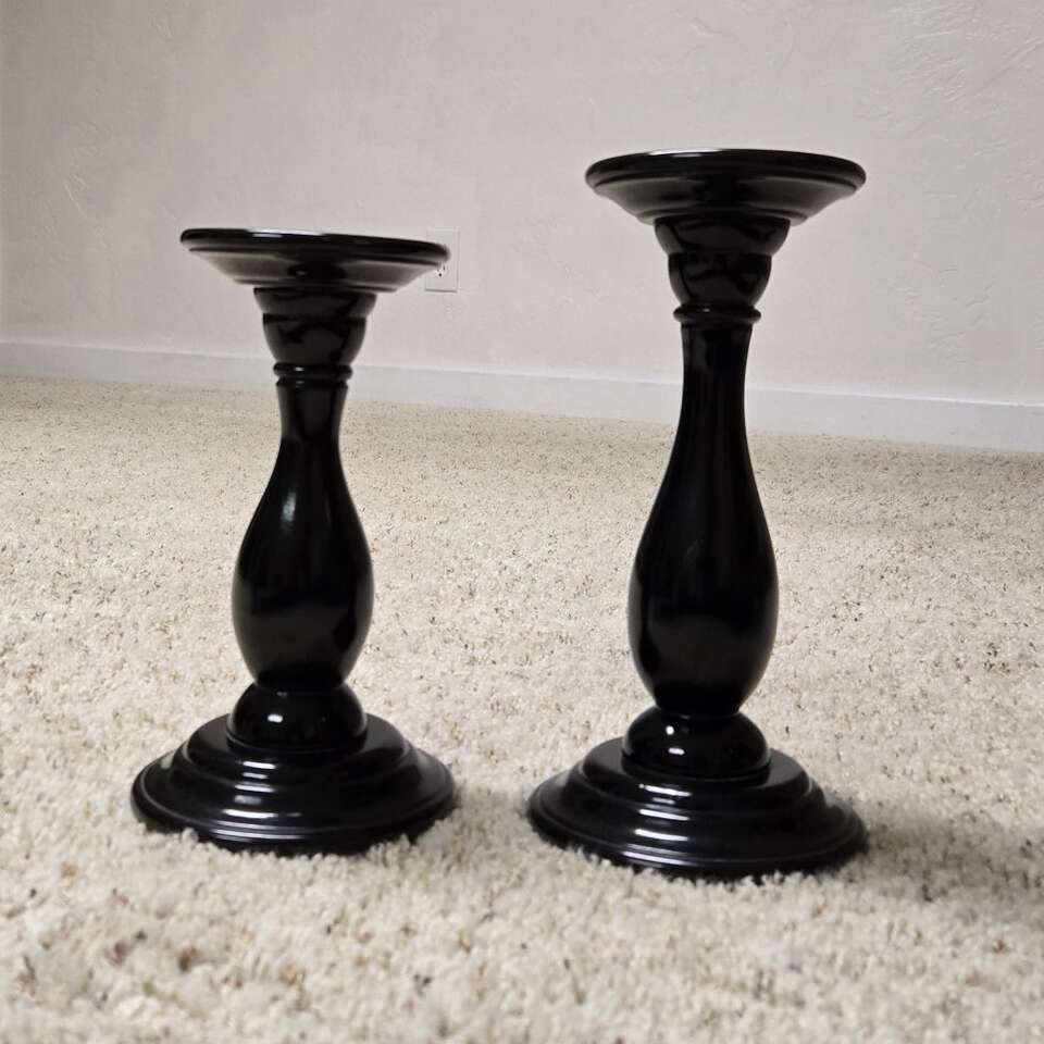 2 black candle holders