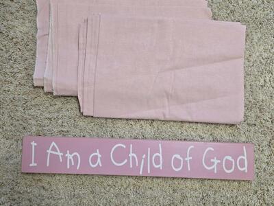 Pink curtains/fabric and sign