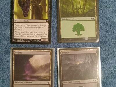 REDUCED. 4 Magic The Gathering cards, very good condition, protected.