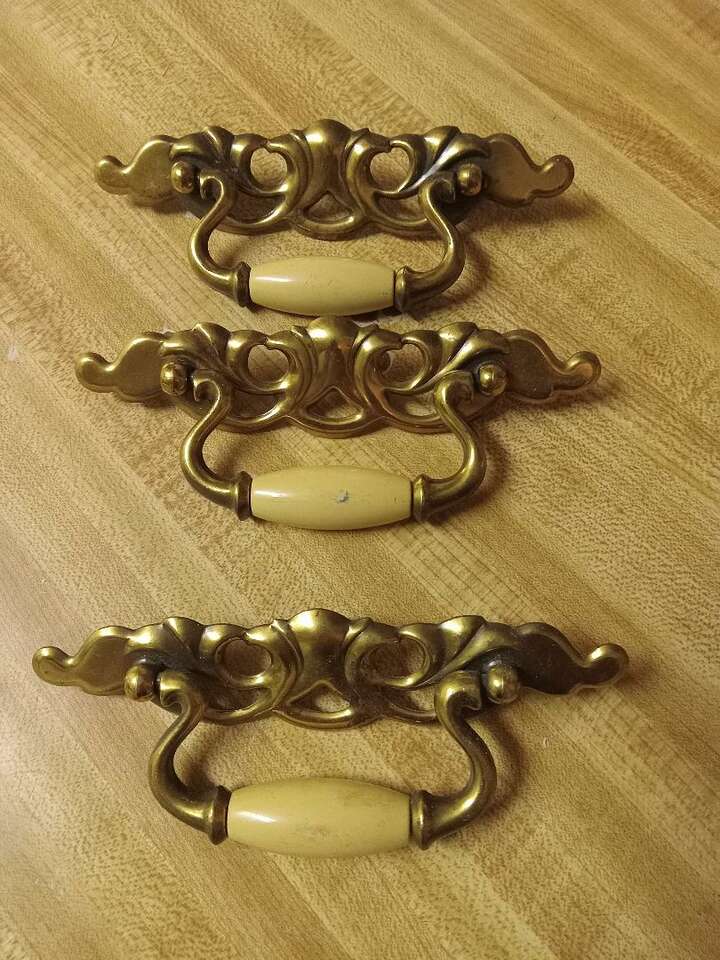 MUST CLEAR. Three vintage drawer handles, brass and pearl or ivory.