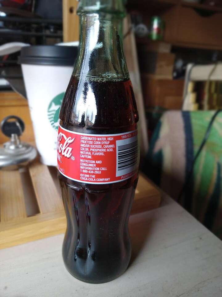 REDUCED> Classic Coca Cola 8 ounce bottle, 1999, with coke.
