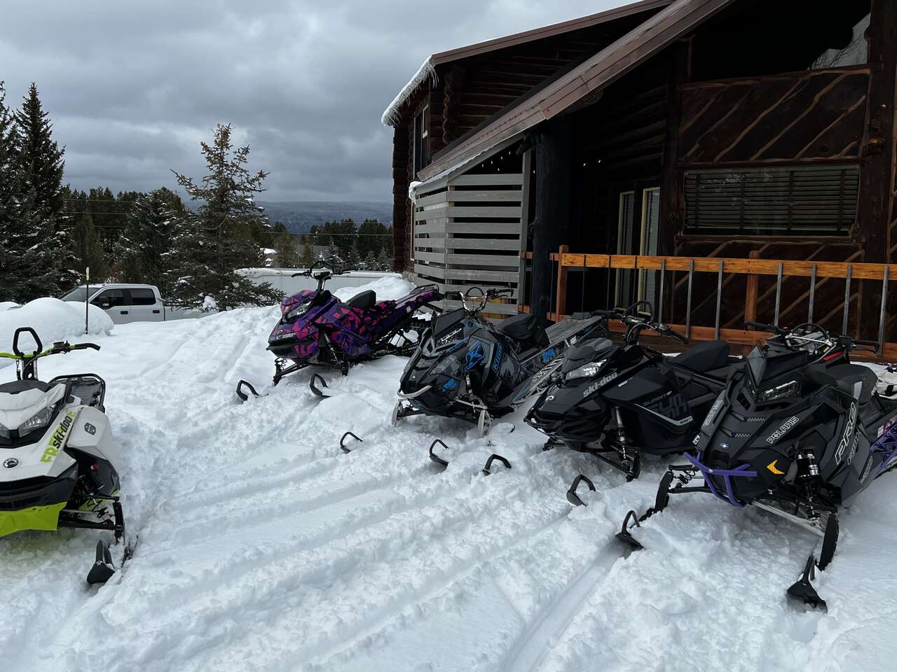Island Park cabin with snowmobiles