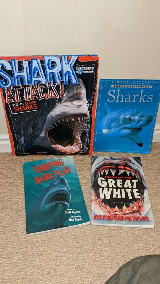 Lot of 4 paperback shark books.
All 4 are in good
