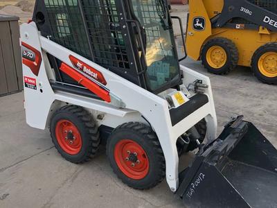 Mini Bobcat skid steer for rent. Only 36 inches wide. Great money saver