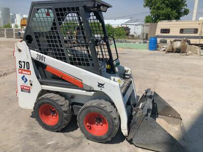 Mini Bobcat for rent. Only 36 inches wide. Perfect skid steer to save money!