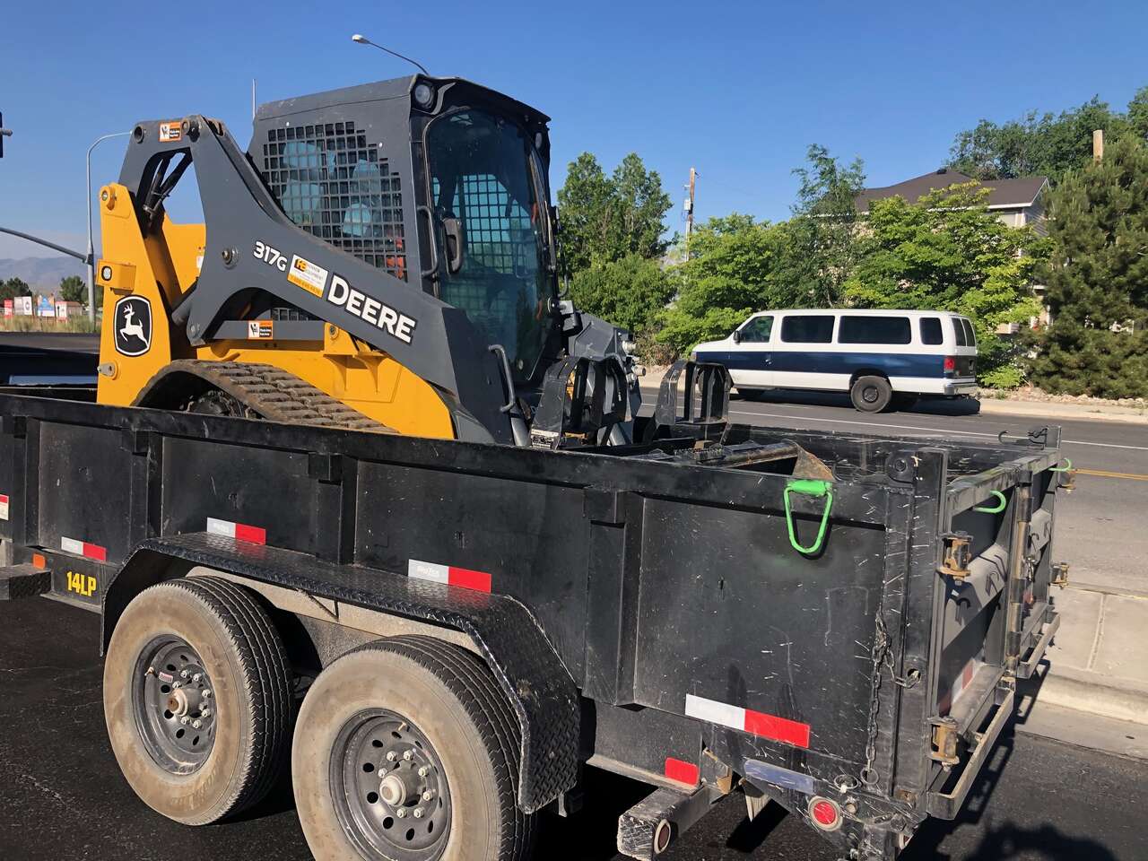 Track skid steer loader and XL dump trailer for rent.