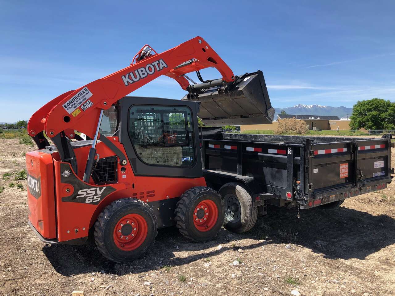 Bobcat skid steer and XL dump trailer for rent
