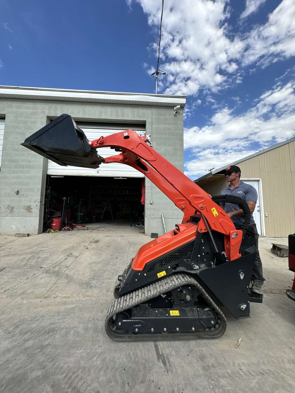 Mini skid steer loader for rent. Stand-on Kubota dingo. Great for small spaces
