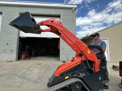 Mini skid steer loader for rent. Stand-on Kubota dingo. Great for small spaces